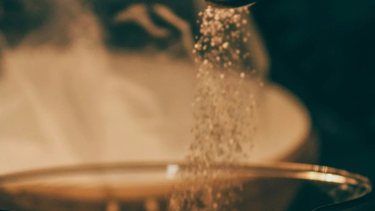 Illustrative photograph of unlabelled powder being measured for Vitamin B6